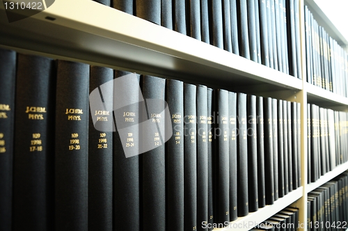 Image of old books in a library