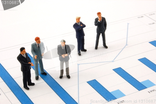 Image of business man over economic chart