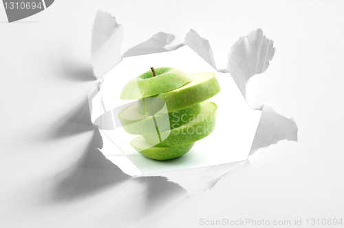Image of sliced apple and hole in paper