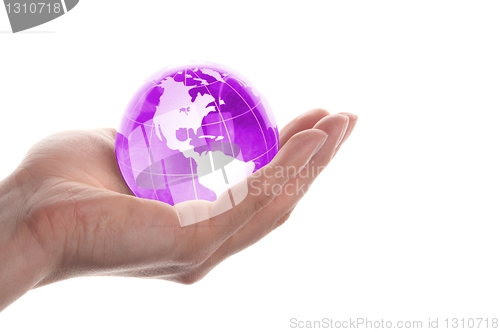 Image of hand holding globe