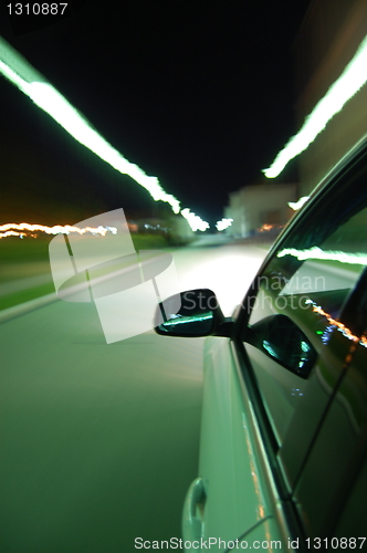 Image of night drive with car in motion 