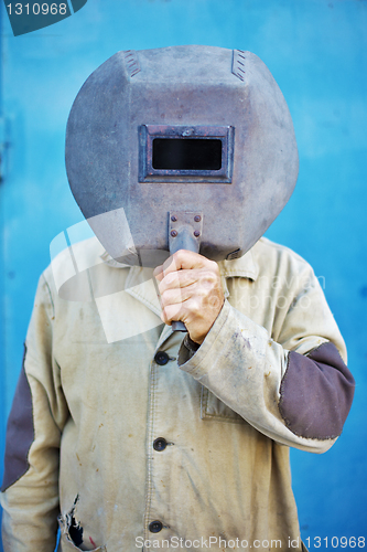 Image of Builder - welder with old welding mask