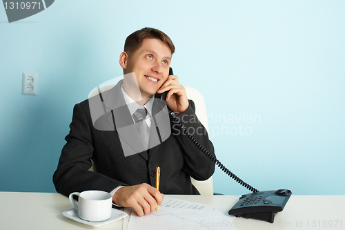 Image of Business man talking on phone