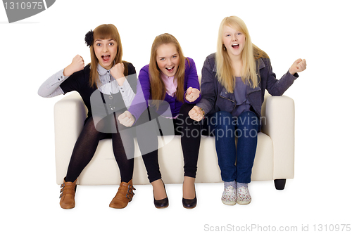 Image of Jubilant young woman on sofa