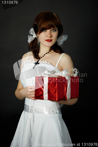 Image of Young woman gives gift