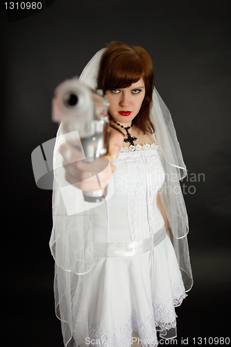 Image of Young bride threatens us with a gun