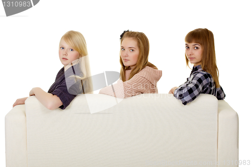 Image of Three young girls - classmate on couch