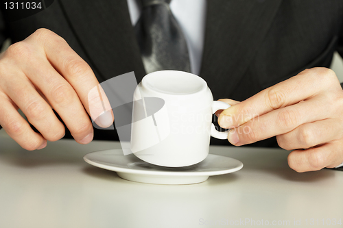 Image of Businessman guesses on coffee grounds