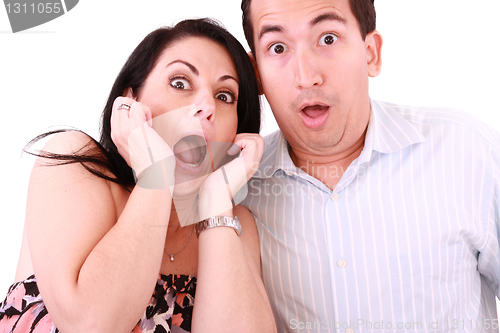 Image of young adult couple in cinema movie theater scared while watching