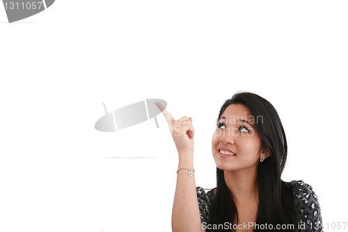 Image of happy smiling young business woman showing blank area for sign o