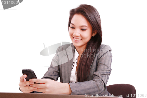 Image of beautiful asian bussines woman using cellphone 