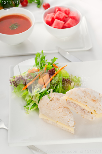 Image of tuna and cheese sandwich with salad