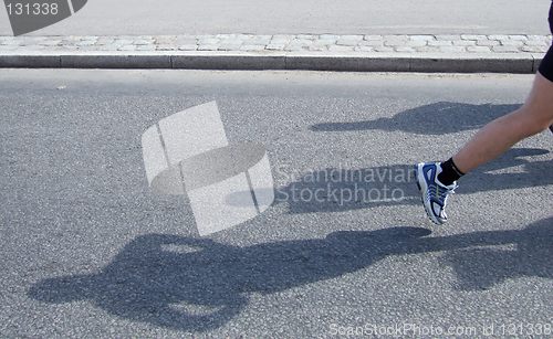 Image of Shadows of people running Stockholm marathon