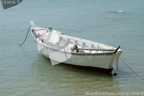 Image of Small, white, wooden fishing boat