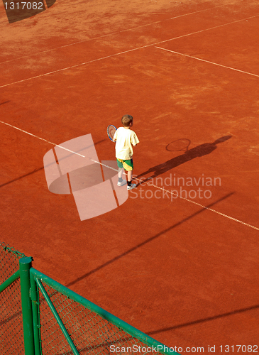 Image of Boy On Tennis Court