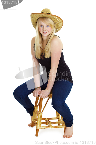 Image of Attractive girl in the wicker hat