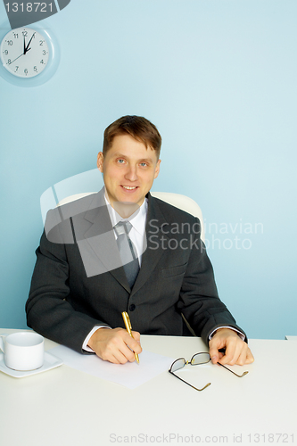 Image of Smiling business man at office