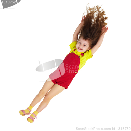 Image of Happy little girl falls down