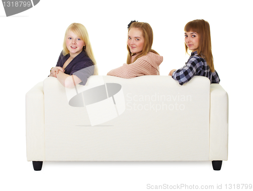 Image of Three girls teens sitting on the couch