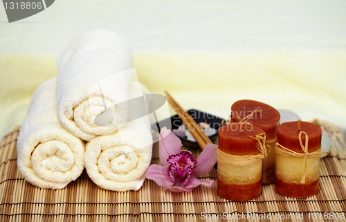 Image of Still life on theme spa - candle, mat, towels