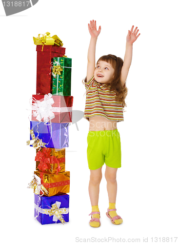 Image of A child enjoys a lot of gifts for his birthday