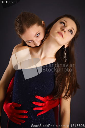 Image of Two young girls portrayed vampire and sacrifice