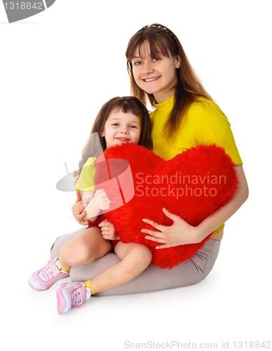 Image of Mom and daughter with a toy heart in hands
