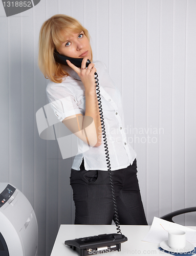 Image of Young woman calls by phone