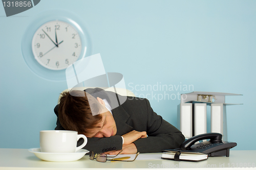 Image of man sleeping on the job