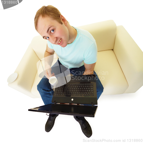 Image of Emotional man with a laptop and a cup of coffee