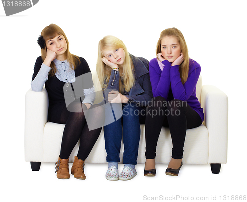 Image of Young girls are sad sitting on couch