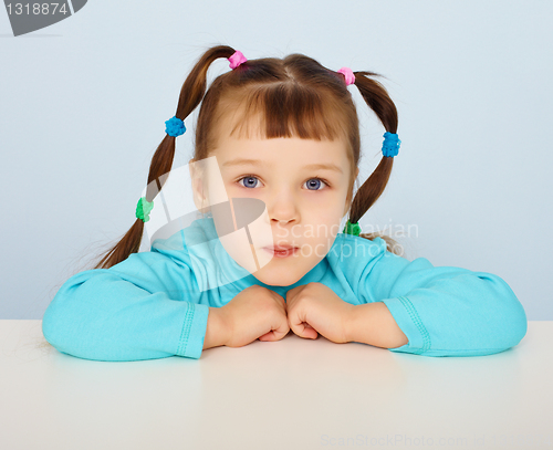 Image of Little girl sitting at desk