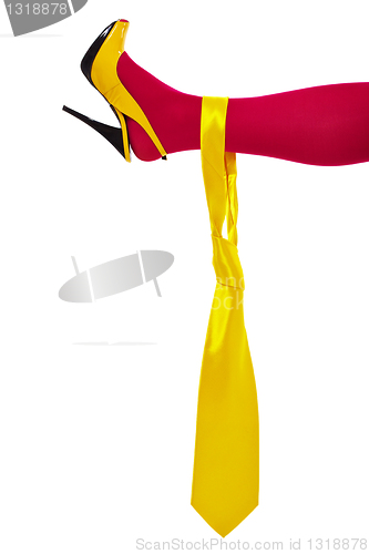 Image of Male yellow necktie on female leg