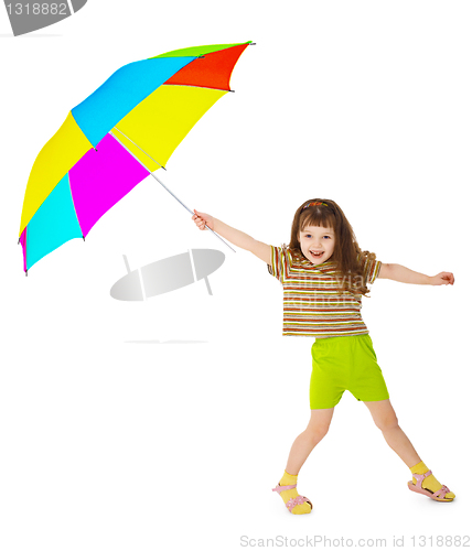 Image of Little happy girl is playing with color umbrella