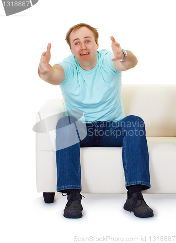 Image of Man sits on couch in despair