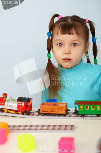 Image of Amazed child and toy railway