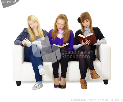 Image of Three girls teen carefully read the books