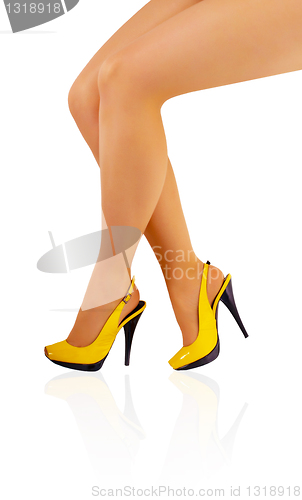 Image of Beautiful legs of young girl in tights and yellow shoes