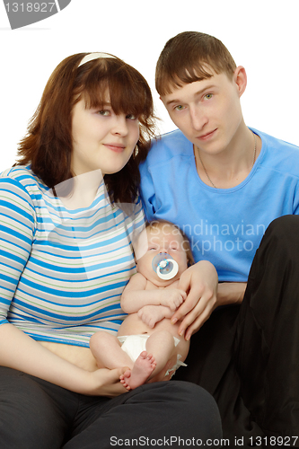 Image of Young family - dad, mom and baby