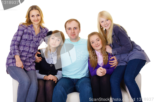 Image of Big family on couch - four women and one man