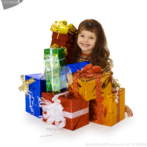 Image of Happy child and big heap of gifts