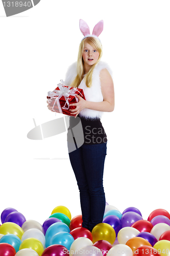 Image of girl dressed as a rabbit with a gift