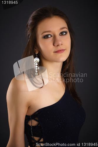 Image of Portrait of young woman in blue dress