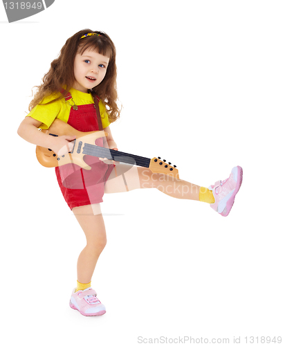 Image of Little girl with toy guitar on white background