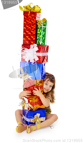 Image of Little girl hugs birthday gifts