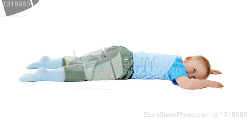 Image of Child stumbled, fell and lay on white background