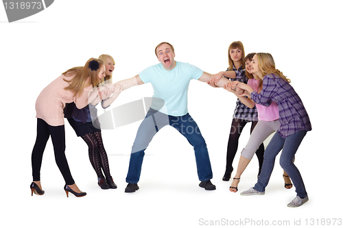 Image of Girls pull man's hands