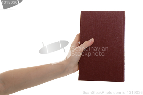 Image of hand holds a book