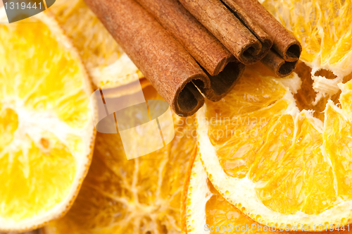 Image of Dried orange and cinnamon sticks - christmas decoration