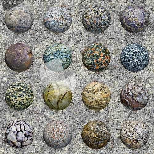 Image of Set of stone balls on granite wall - seamless texture